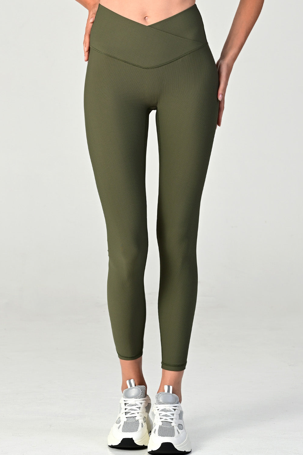 Woman wearing the Melrose army ribbed leggings close up front view.