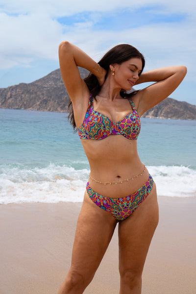 Full View Front view of a XL size woman wearing the Laguna bikini Mexican Tiles set on the sea background