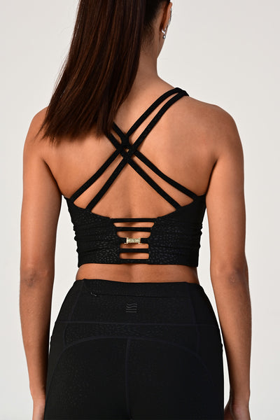 Woman wearing the Hollywood longline bra top back view.