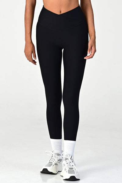Woman wearing the melrose black ribbed leggings close up front view.
