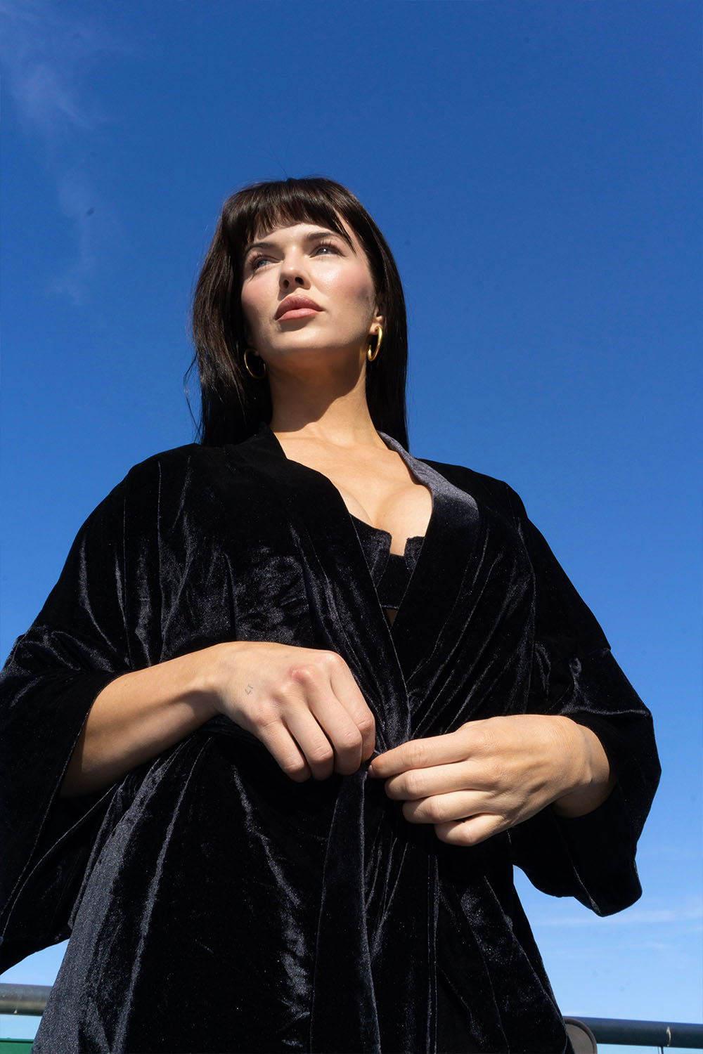 Close-up front view of a woman wearing the Black Velvet Cover Up