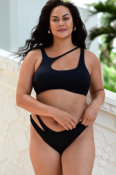 Front view of a woman wearing the Asymmetric Bikini Black Set.